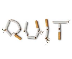 broken cigarettes arranged to form the word quit
