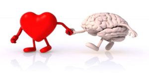 A love heart with legs and arms taking a brain with legs and arms by the hand and leading the brain forward
